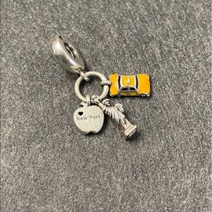 Symbols of New York City dangle charm